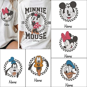 May include: White t-shirts featuring Disney characters. Designs include Mickey Mouse, Minnie Mouse, Donald Duck, Goofy, and Pluto, each within a checkered circle. One shirt has "MINNIE MOUSE" text on the back.