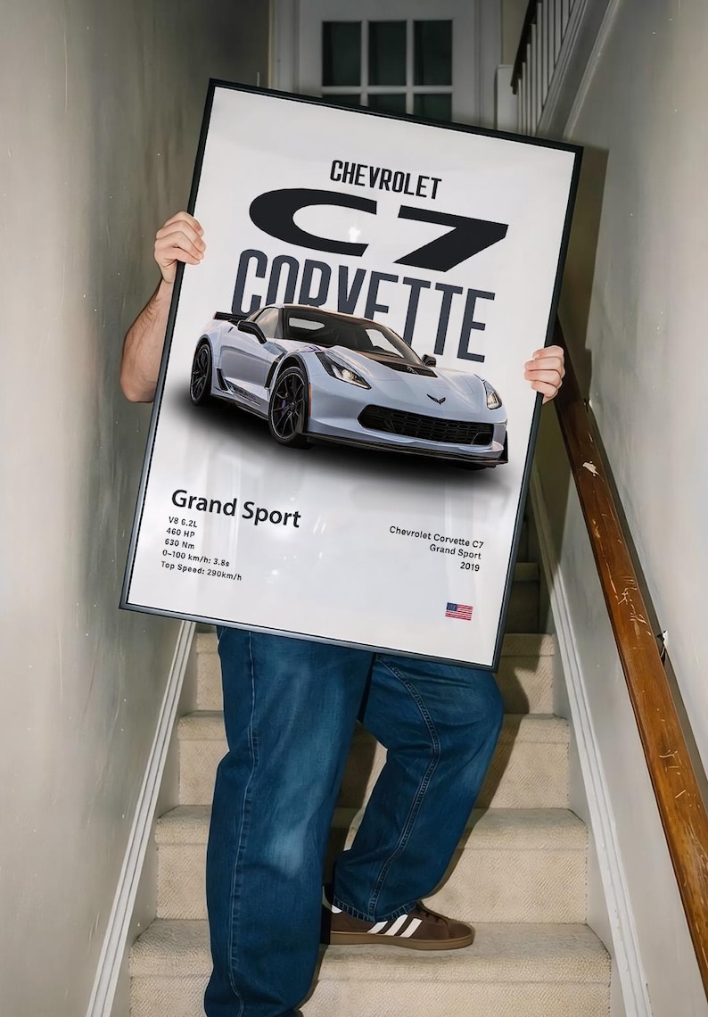 May include: A framed poster featuring a light blue Chevrolet Corvette C7 Grand Sport. The poster includes the car's specifications, such as the V8 6.2L engine and 460 HP. The text "Chevrolet Corvette C7 Grand Sport 2019" is also visible.