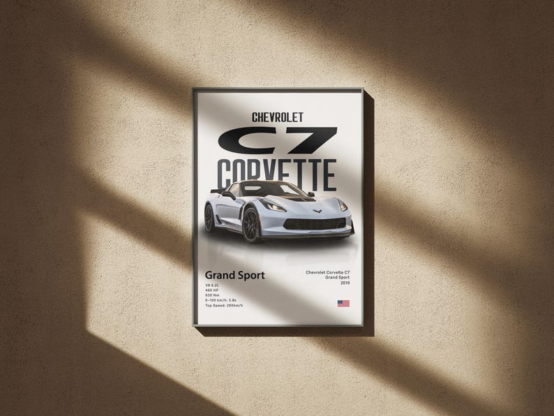 May include: Framed poster featuring a white Chevrolet C7 Corvette Grand Sport. The poster includes the car's name, specifications, and the American flag. The car is depicted in a studio setting, with the text "Chevrolet C7 Corvette" at the top.