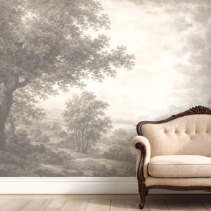 May include: A sepia-toned mural depicting a classical landscape scene with trees, hills, and a body of water. A cream-colored sofa with dark wood trim sits in front of the mural, creating a vintage aesthetic.