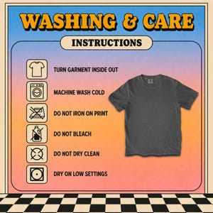 May include: A charcoal gray t-shirt displayed next to a list of washing and care instructions. The text reads: WASHING & CARE, INSTRUCTIONS, TURN GARMENT INSIDE OUT, MACHINE WASH COLD, DO NOT IRON ON PRINT, DO NOT BLEACH, DO NOT DRY CLEAN, DRY ON LOW SETTINGS.
