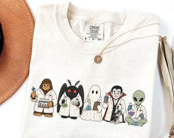 Mad Scientists Cryptid T-Shirt, Cute Halloween Science Tee, Spooky Lab Shirt, Bigfoot Mothman Ghost Vampire UFO Top, Funny Gift For Nerds