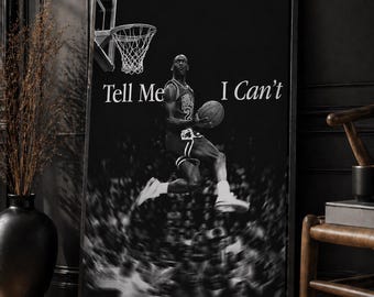 May include: Black and white framed poster featuring a basketball player mid-air, holding a ball, with the words "Tell Me I Can't". The image includes a basketball hoop and a blurred crowd.