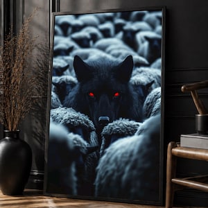 May include: Framed art print featuring a black wolf with glowing red eyes, centered amidst a flock of sheep. The artwork is predominantly dark, with shades of black and gray, creating a dramatic and intense visual.