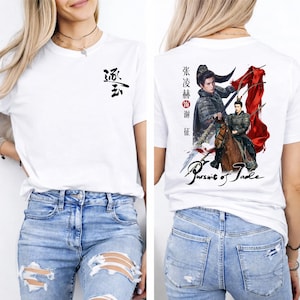 May include: White t-shirt with a black graphic on the front and a detailed illustration on the back. The front features Chinese characters. The back displays a warrior on horseback with the text "Pursuit of Jade".