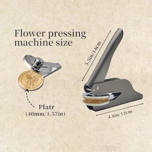 May include: A flower pressing machine with a silver and gray finish. The machine is 4.8 inches wide and 5.5 inches tall. The image also shows a pressed flower with a diameter of 1.57 inches. The text "Flower pressing machine size" is visible.