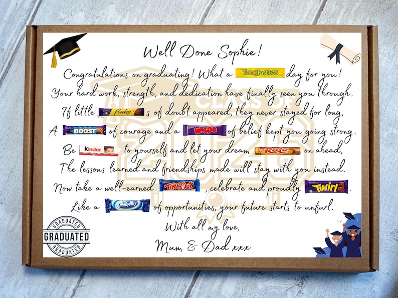 May include: A rectangular cardboard gift box featuring a graduation-themed message for Sophie. The text includes candy bars integrated into the sentences, such as Tangfastics, Flake, Boost, Wispa, Kinder, Roo, TimeOut, Twirl, and MilkyWay, with illustrations of a cap and diploma.