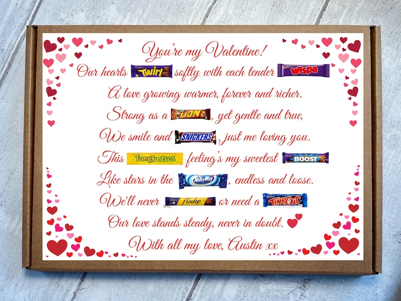 May include: A rectangular cardboard gift box featuring a white insert printed with red hearts and a poem titled You're my Valentine! The poem incorporates various candy bar wrappers including Twirl, Wispa, Lion, Snickers, Tangfastics, Boost, MilkyWay, Flake, and TimeOut.