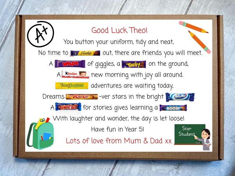 May include: A rectangular cardboard box featuring a printed poem with embedded candy bar names including Flake, Wispa, Twirl, Kinder, Tangfastics, Rolo, Milky Way, Time Out, and Boost. The design includes an A+ symbol, pencils, a backpack, and a chalkboard.