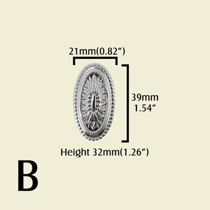 May include: A silver-colored, oval-shaped decorative furniture knob with a detailed floral design. The knob measures 0.82 inches wide, 1.54 inches long, and 1.26 inches in height. The letter "B" is at the bottom.