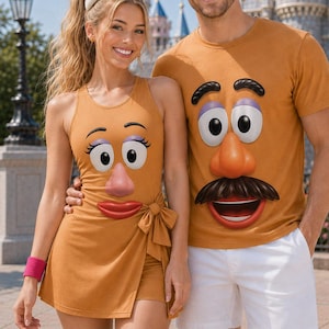 May include: A tan sleeveless wrap dress with a Mrs. Potato Head face graphic and a tan t-shirt with a Mr. Potato Head face graphic featuring a moustache, nose, eyes, and eyebrows. The t-shirt is paired with white shorts and a black bowler hat.