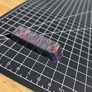 May include: A rustic wooden sign with the text "Welcome to our home" in white lettering. The sign features a distressed finish and a simple, inviting design, perfect for entryway decor.