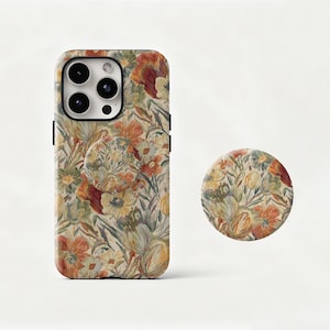 May include: A floral patterned phone case and matching phone grip. The case and grip feature a design with orange, yellow, and green flowers on a cream background. The phone case is designed to fit a smartphone.
