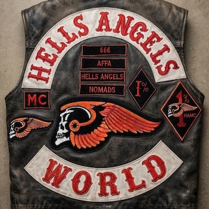 May include: A dark brown distressed leather waistcoat featuring embroidered patches. The back displays the text HELLS ANGELS and WORLD in red on white curved panels. Additional patches include 666, AFFA, HELLS ANGELS, NOMADS, MC, 1%, and a winged skull.