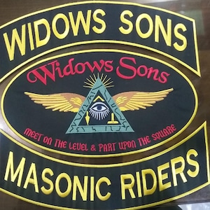 May include: Embroidered patches with the text "WIDOWS SONS" and "MASONIC RIDERS". The central patch features a triangle with an eye, wings, and the words "Widows Sons" and "MEET ON THE LEVEL & PART UPON THE SQUARE".