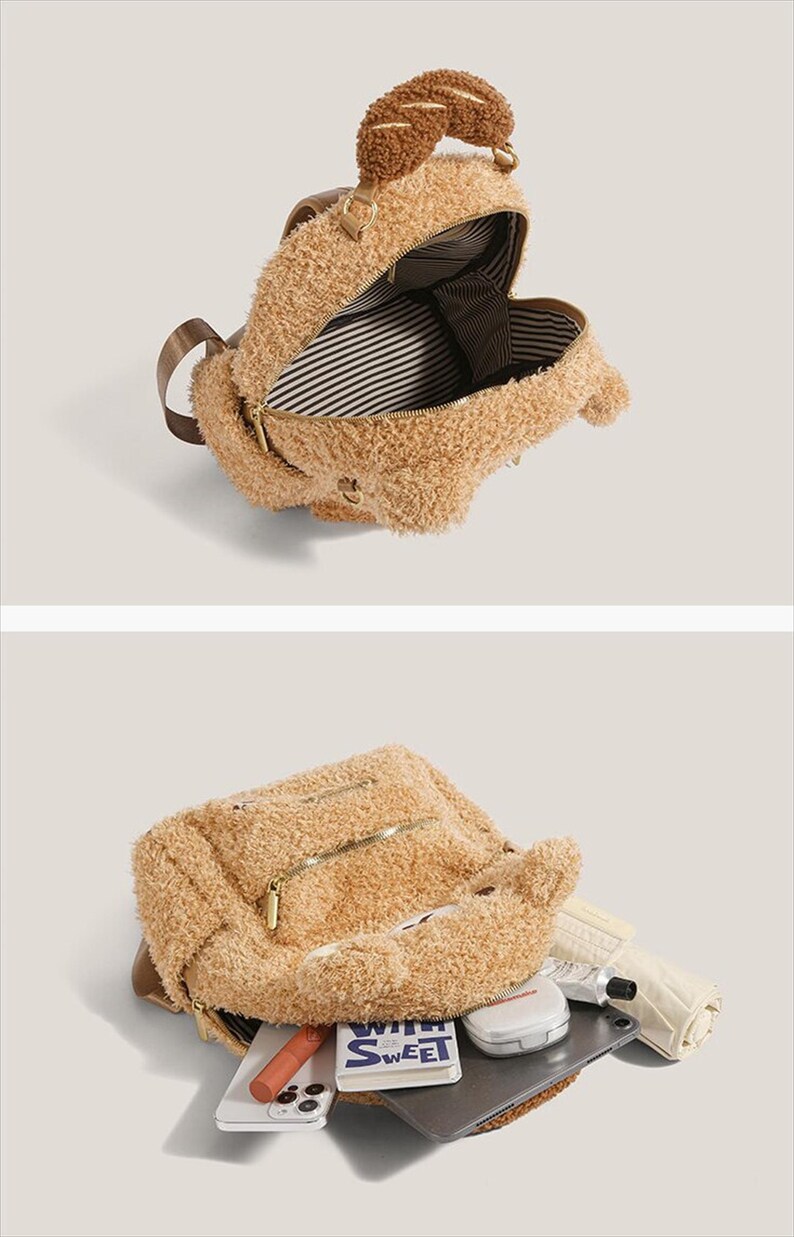 May include: A tan teddy bear backpack with a brown handle and zipper closures. The interior features a striped pattern. The backpack is open, revealing a variety of items inside, including a tablet and a phone.