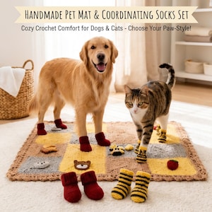 May include: A rectangular crochet pet mat featuring a yellow and gray checkered pattern with small animal-themed appliques, accompanied by two pairs of small knit socks, one pair in solid red and one pair with yellow and black horizontal stripes.