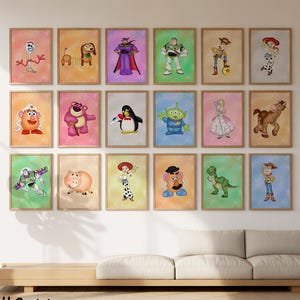 May include: A series of framed watercolour prints showcasing characters from the animated film series. The artwork includes characters such as Buzz Lightyear and Woody, set against colourful backgrounds. The prints are displayed on a wall above a sofa.