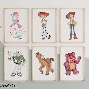 May include: Six framed art prints featuring characters from the animated film series. The prints include Bo Peep, Jessie, Woody, Buzz Lightyear, Bullseye, and Lotso. Each character is depicted in a colorful, cartoon style, set against a white background.