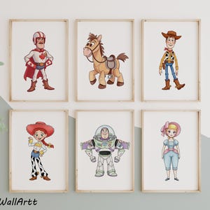 May include: Six framed art prints featuring cartoon characters. The prints include a superhero, a horse, a cowboy, a cowgirl, an astronaut, and a girl in a bonnet. The artwork is in a colorful, illustrative style, suitable for a child's room.