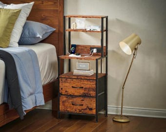 May include: A rustic nightstand with a black metal frame and two drawers. The nightstand has a wooden top and shelves, with a built-in charging station. A gold-colored floor lamp stands beside the nightstand.