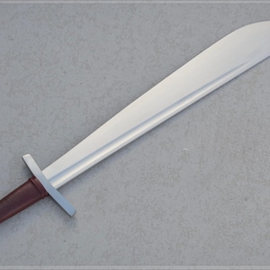May include: A medieval-style sword with a wide, silver blade and a brown leather-wrapped handle. The handle has a silver pommel and crossguard. The sword is displayed against a neutral gray background.
