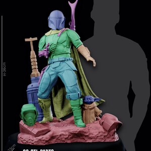 May include: A colorful resin figure of a character in green, blue, and purple armor, with a cape and a weapon. The figure is standing on a reddish-brown base with a small green figure. The base is 23 cm deep and 26 cm wide, and the figure is 36 cm tall. The text "23 STL PARTS" is visible.