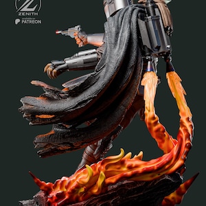 K&ouml;nnte beinhalten: Eine detaillierte Statue von The Mandalorian mit Grogu, die auf einem feurigen Sockel steht. Der Mandalorianer tr&auml;gt eine silberne R&uuml;stung und h&auml;lt einen Blaster. Grogu befindet sich in einer Tasche. Der Sockel hat orange und gelbe Flammen. Der Text "ZENITH available on PATREON" ist sichtbar.