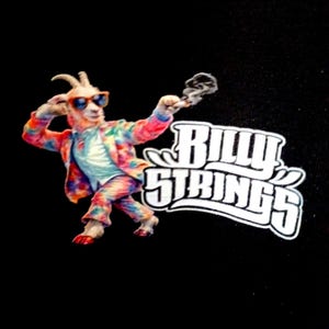 May include: A black graphic featuring a goat wearing sunglasses and a colorful tie-dye outfit, holding a lit object. The text "Billy Strings" is in a white, stylized font.