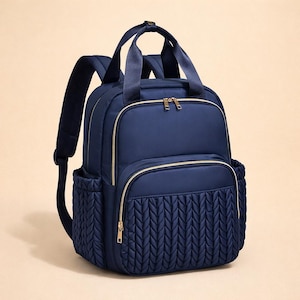 Navy blue diaper backpack on beige background, modern baby diaper bag and hospital backpack