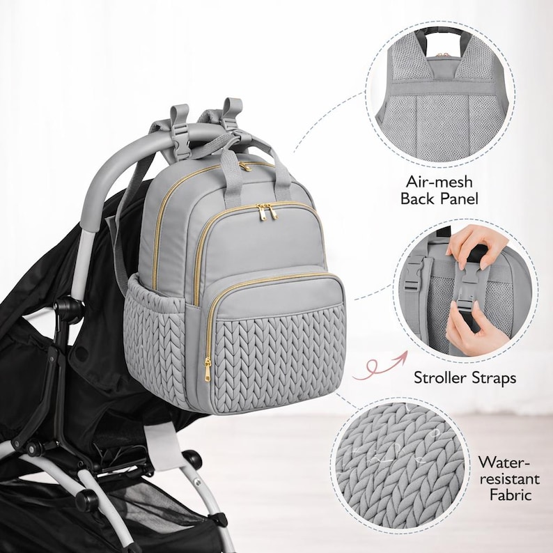 Gray diaper backpack attached to stroller showing storage pockets and water resistant fabric
