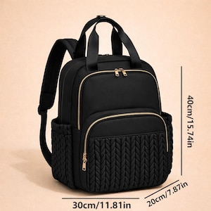 Black diaper backpack with size dimensions shown, spacious baby travel bag