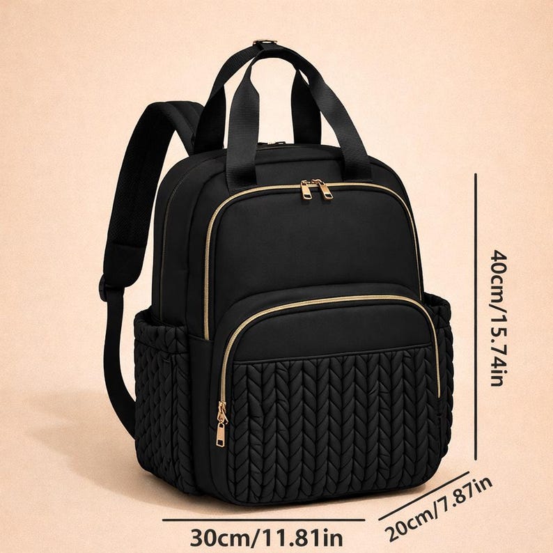 Black diaper backpack with size dimensions shown, spacious baby travel bag