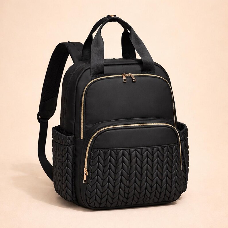 Black diaper backpack on beige background, elegant diaper bag for parents
