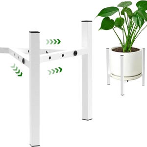 May include: White metal plant stand with a square base and a cross-shaped top. The stand has a modern design and is shown with a potted plant. The stand is designed to elevate plants and add a decorative touch to any space.