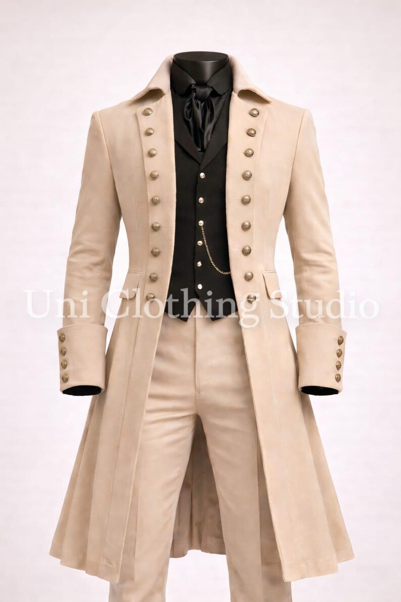 May include: A beige long coat with two rows of gold-toned buttons, worn over a black waistcoat with a gold chain and a black shirt. The coat features wide lapels and cuffs with four buttons each. The text Uni Clothing Studio is visible in the centre.