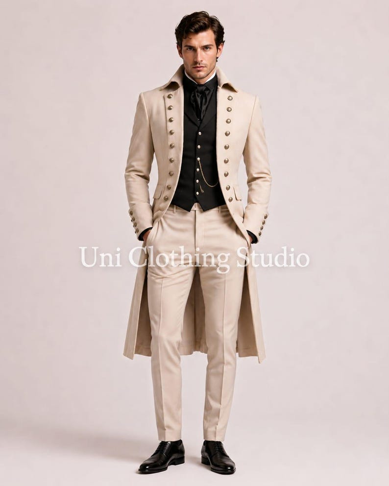 May include: A beige long coat with two rows of metallic buttons, worn over a black waistcoat and black shirt with a cravat. The outfit includes matching beige trousers and black dress shoes. The text Uni Clothing Studio is visible.