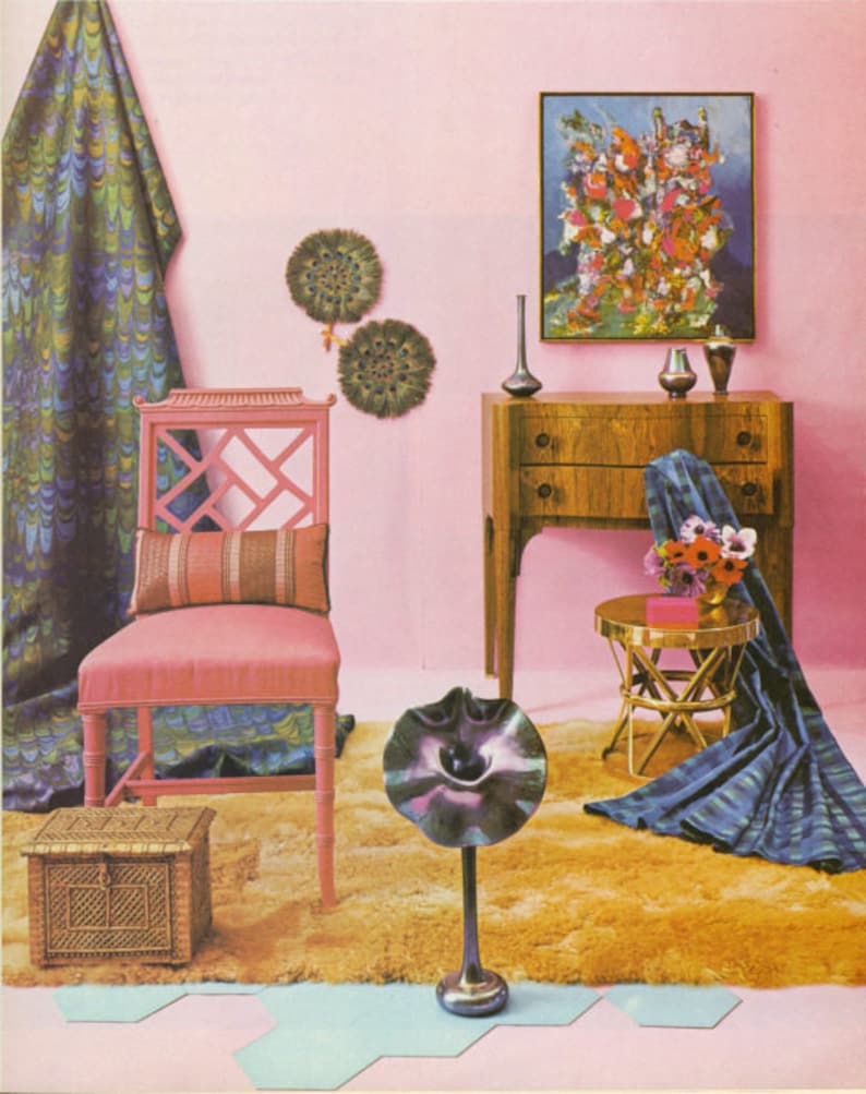 May include: A retro-style interior scene with a pink wall, featuring a pink chair, a wooden dresser, and a small gold table. The room is decorated with a patterned curtain, artwork, and decorative objects, creating a vintage aesthetic.