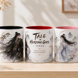 May include: Three ceramic mugs featuring illustrations of characters in traditional attire. The left mug has a black handle and interior, the center mug has a red interior, and the right mug has a pink handle and interior. All mugs display the text Tale of Herding Gods.