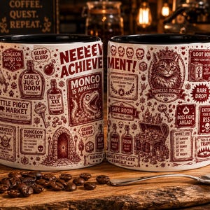 May include: A white ceramic mug with a black handle and interior, featuring a detailed dark red graphic print of fantasy-themed text, a cat wearing a crown, a treasure chest, potions, and various dungeon-related icons and labels.