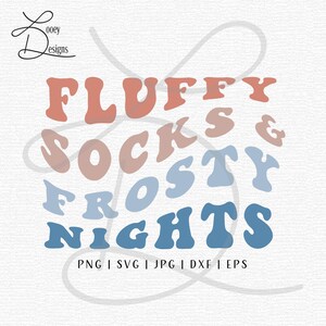 May include: A digital graphic design with the words "FLUFFY SOCKS & FROSTY NIGHTS" in a retro font. The text is in shades of orange, pink, and blue. Below the text are file type abbreviations: PNG, SVG, JPG, DXF, and EPS.