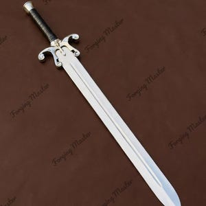 May include: A silver-colored metal sword with a double-edged blade and a central fuller. The hilt features a black wrapped grip, a metallic pommel, and a decorative crossguard with curved ends. The text Forging Master appears repeatedly.