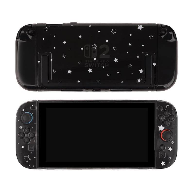 May include: Black Nintendo Switch console with a starry design. The console features a black screen and controllers with white star accents. The back of the console has the Nintendo Switch logo and additional star patterns.