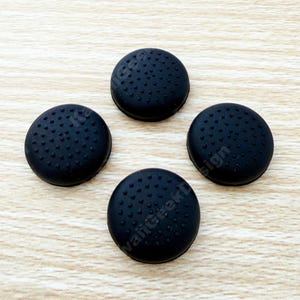 May include: A set of three ceramic mugs with a speckled, matte finish. The mugs are in shades of cream, light gray, and dark gray. Each mug has a simple, minimalist design, perfect for coffee or tea.