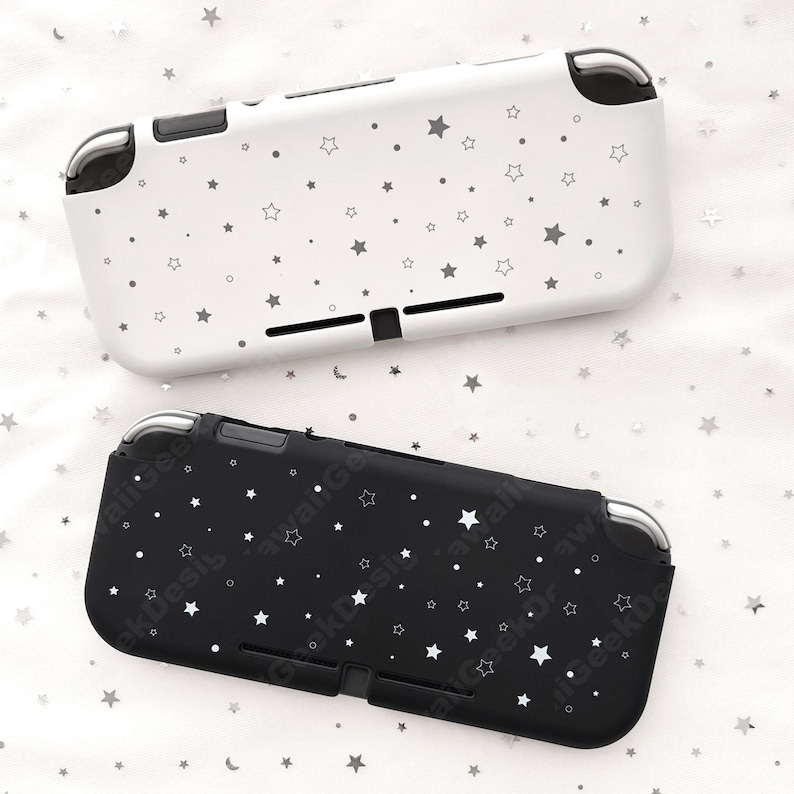 May include: Two protective cases for a gaming console, one white and one black. Both cases are decorated with a pattern of small, gray stars. The cases have cutouts for buttons and ports.