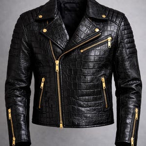 May include: Black leather jacket with a crocodile skin texture. The jacket features a classic biker style with a notched collar, quilted shoulders, and multiple zippered pockets. Gold-colored zippers and hardware provide contrast.