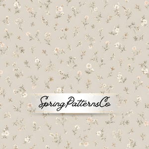 May include: A light beige background featuring a repeating pattern of small, delicate white and soft brown flowers with green stems and leaves. A white rectangular banner is centered with the black cursive text SpringPatternsCo.