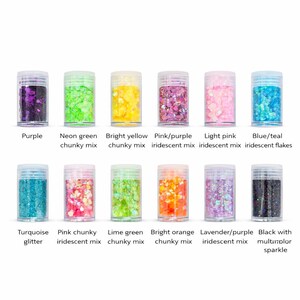 May include: A collection of twelve small, clear plastic jars filled with various colors of glitter. Colors include purple, neon green, bright yellow, pink/purple, light pink, blue/teal, turquoise, pink chunky, lime green, bright orange, lavender/purple, and black with multicolor sparkle.