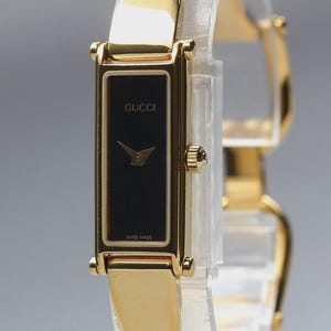Reloj de mujer GUCCI 1500 de 13 mm, color oro y negro, de cuarzo, rectangular, procedente de Japón [Casi nuevo]