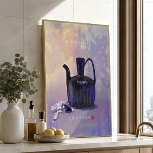 May include: A framed wall art print featuring a dark blue, vertically striped teapot with a long spout and handle. The background is a soft, textured purple and yellow gradient. The text "BLACK GLAZED TEAPOT" is printed in white near the top.